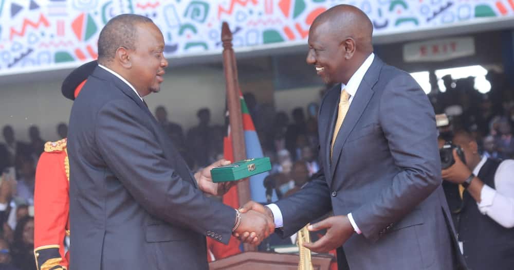Uhuru Kenyatta greets William Ruto during his inauguration.