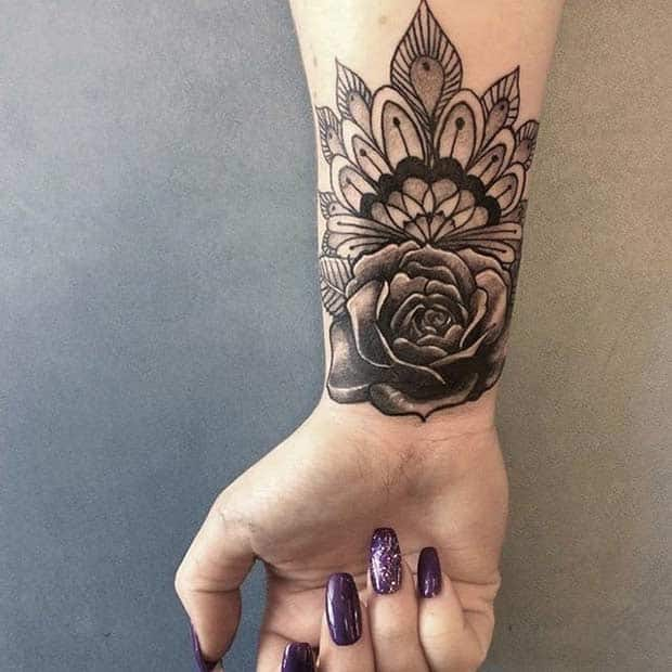 Big Wrist Band Tattoo Idea | Wrist tattoos for women, Tattoos, Flower wrist  tattoos