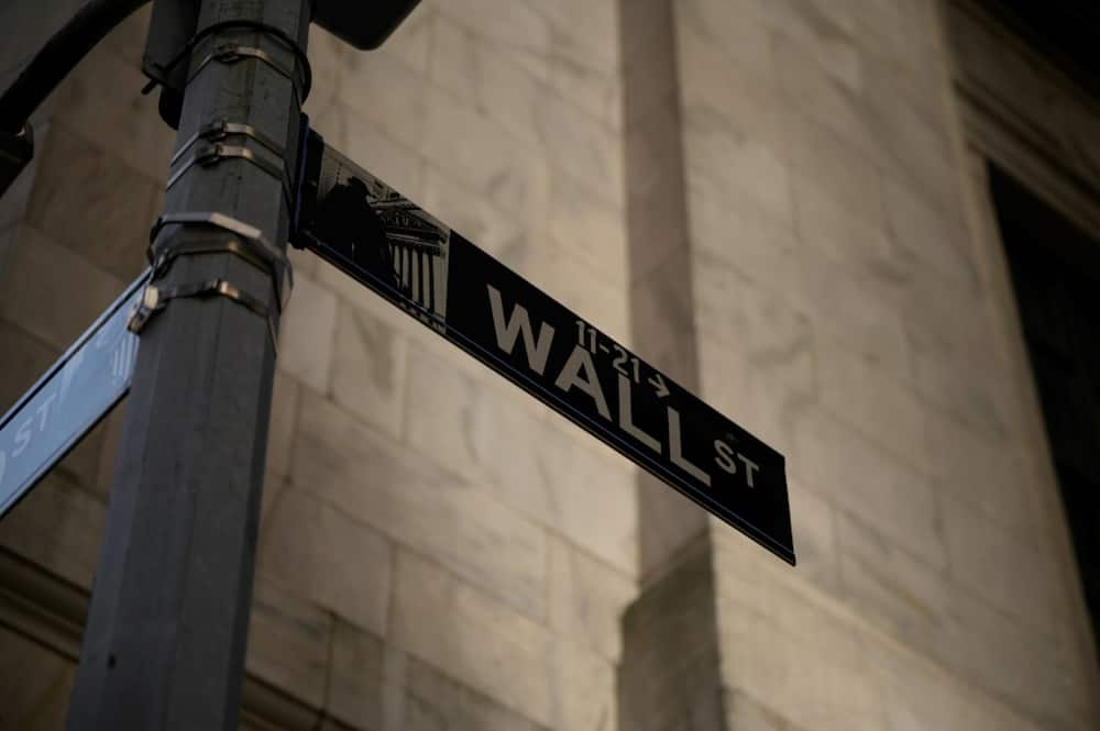A general view shows a Wall Street sign outside the New York Stock Exchange (NYSE) in New York