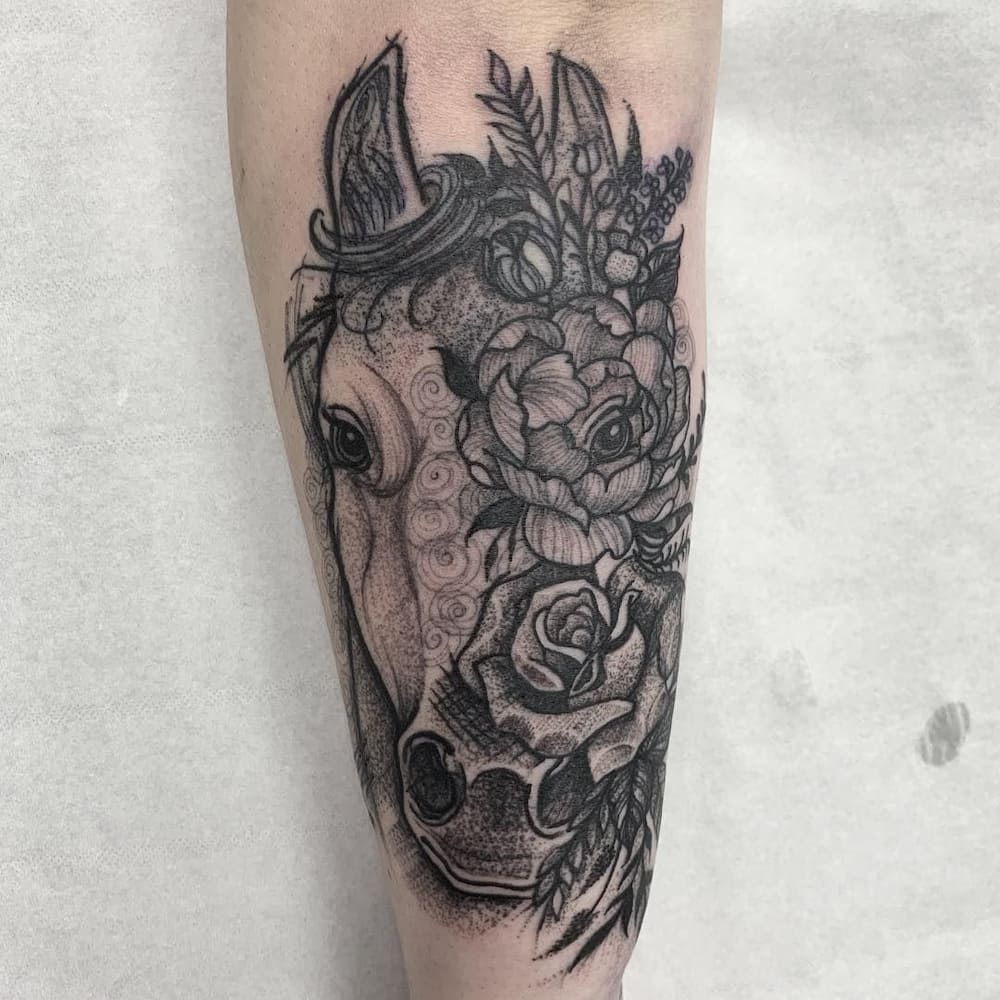 Horse and daisy tattoo