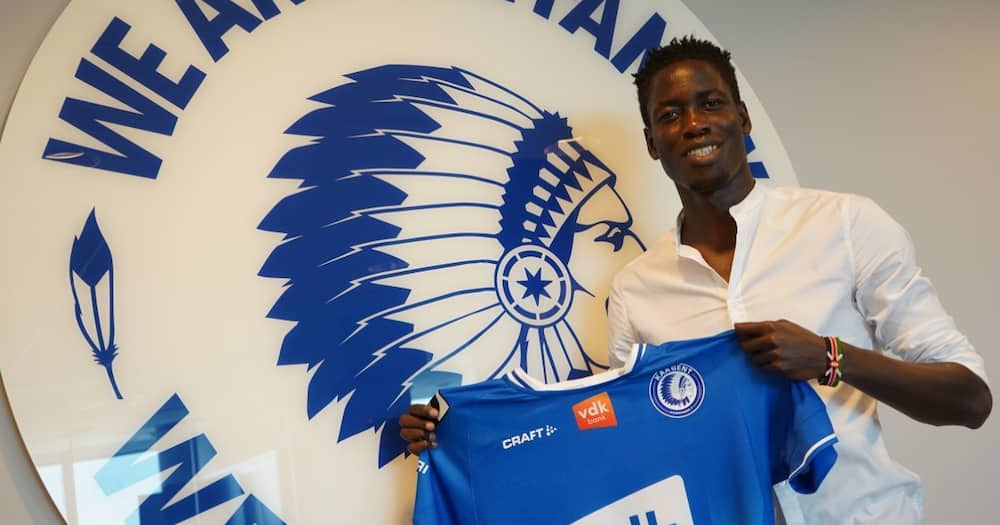 Joseph Okumu poses with a Gent shirt after sealing a transfer to the Belgian club in June 2021. Photo: Twitter.