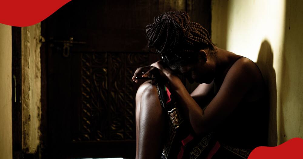 Crying Kenyan woman.