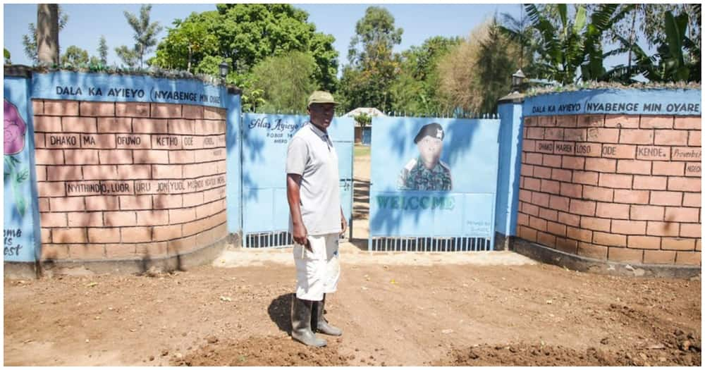 The retired senior police officer goit his portrait done on his gate.