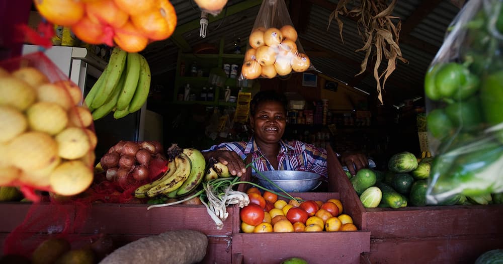 Market woman selling fruits.