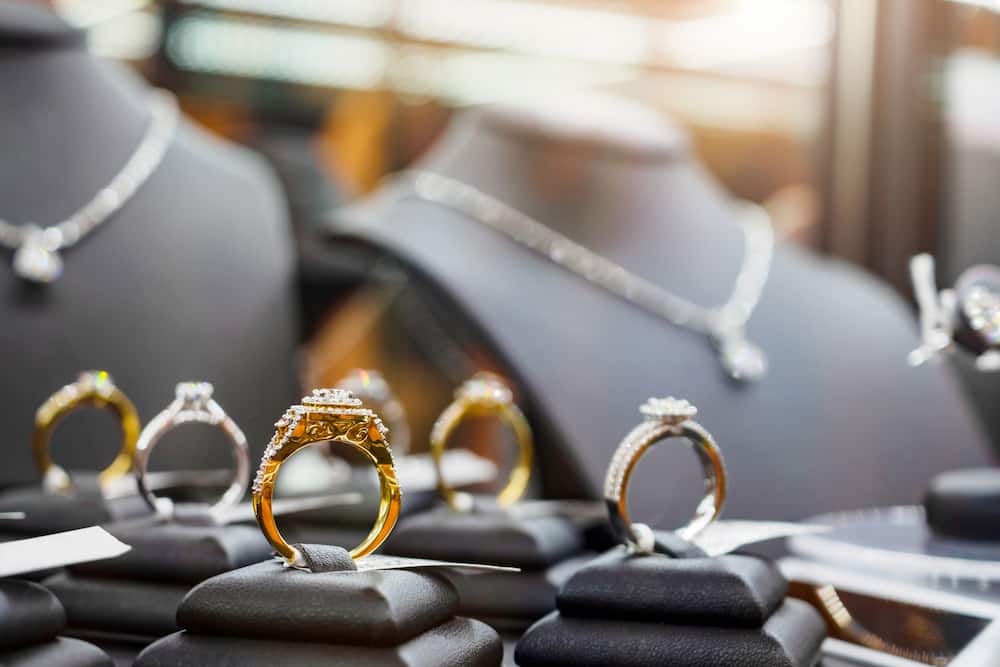 Gold jewellery and diamond rings showcased in a luxury retail store window