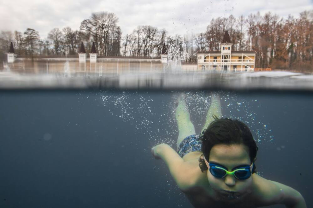A child swims in the hot thermal lake at Heviz, Hungary