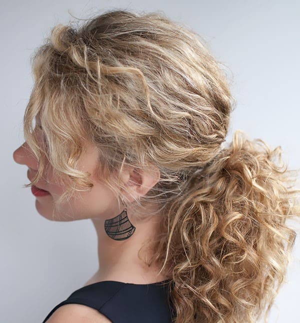 Beautiful woman with curly hair ponytail