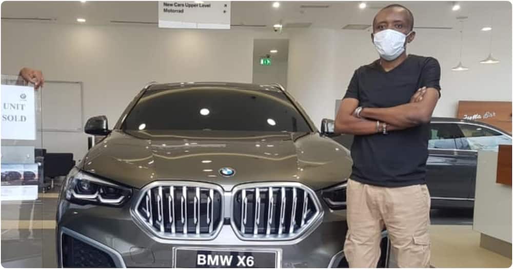 Maina Kageni displays his BMW X6 car.