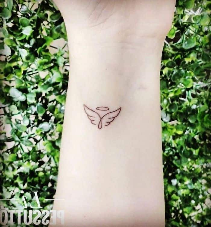 50 EyeCatching Wrist Tattoo Ideas  Art and Design  Wrist tattoos for  guys Feather tattoos Wing tattoos on wrist