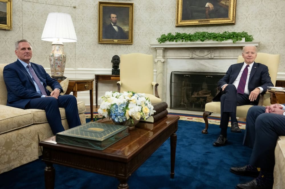 President Joe Biden (R) meets with Republican House Speaker Kevin McCarthy in the Oval Office to discuss a standoff on raising the US debt ceiling