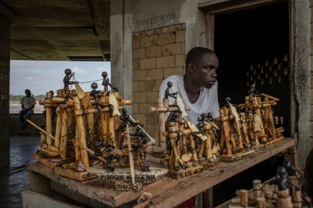 Souvenirs portraying traditional Wagenya life are on sale for the few tourists who visit the impoverished DR Congo area