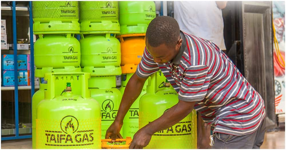 A retailer arranging Taifa Gas.