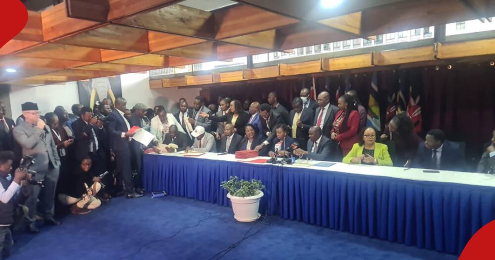 Officials from KMPDU and national government at a meeting.