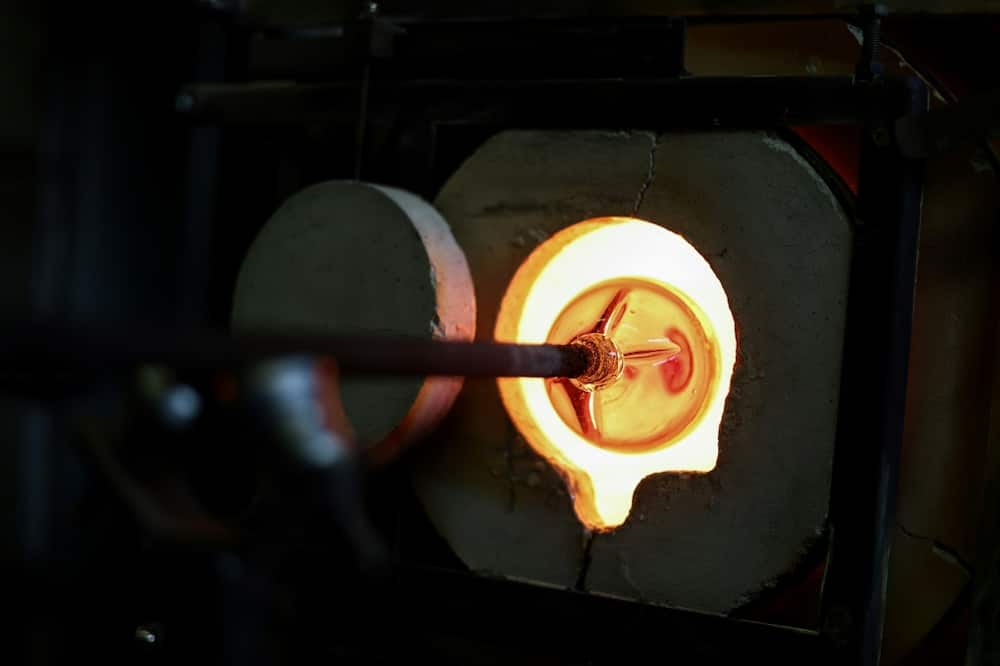 Christophe Genard cut his monthly gas expenses by half by switching to gas cylinders to fire up the oven of his glassblowing business