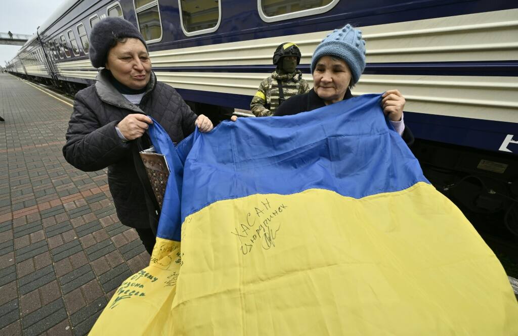 'We're free': Ukraine families reunite as Kherson train station reopens ...