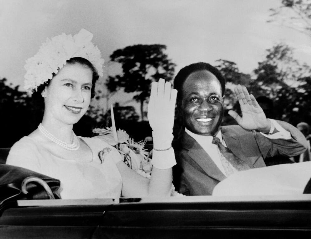 The queen and Ghana's first post-independence president, Kwame Nkrumah, wave to the crowd during a royal visit in 1961