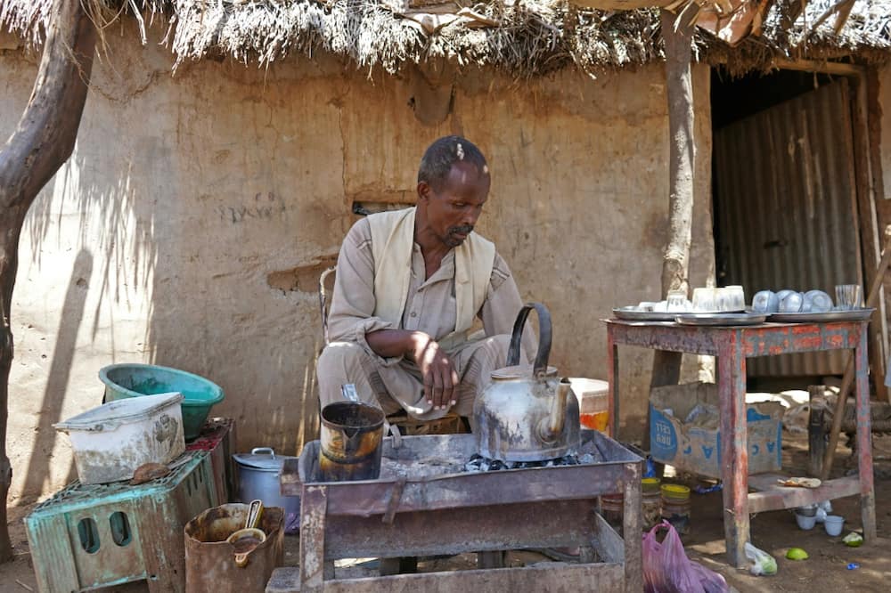 Abdalla Ibrahim, who owns a coffee shop, has several of his seven children either working with him or at a bakery