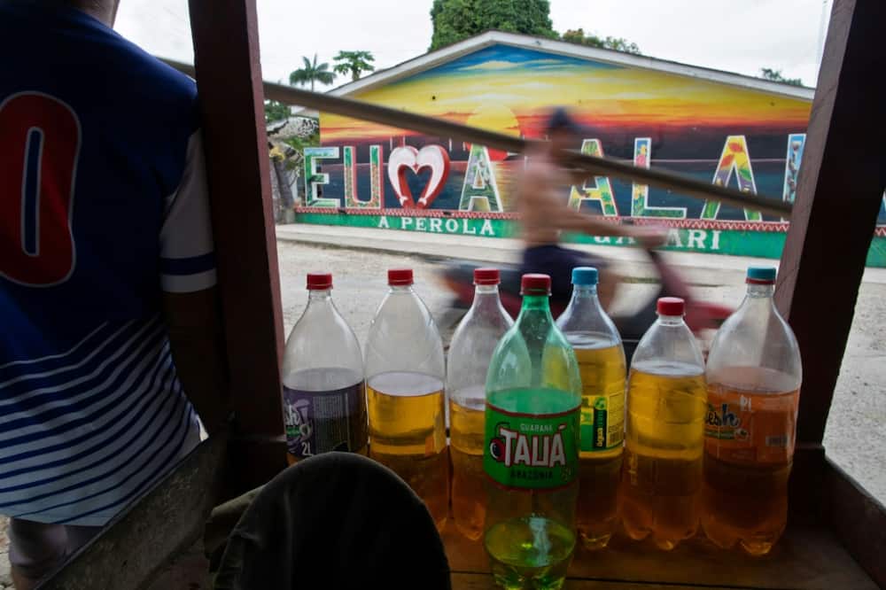 Gasoline is sold in plastic bottles in the streets of Atalaia do Norte