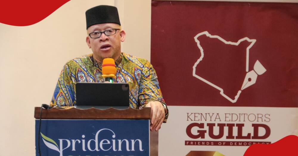 Government Spokesperson Isaac Mwaura speaking at a media event.