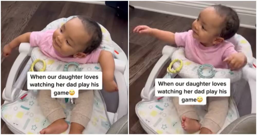 Toddler reacts to dad playing video game.