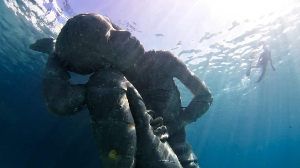 scary underwater statues