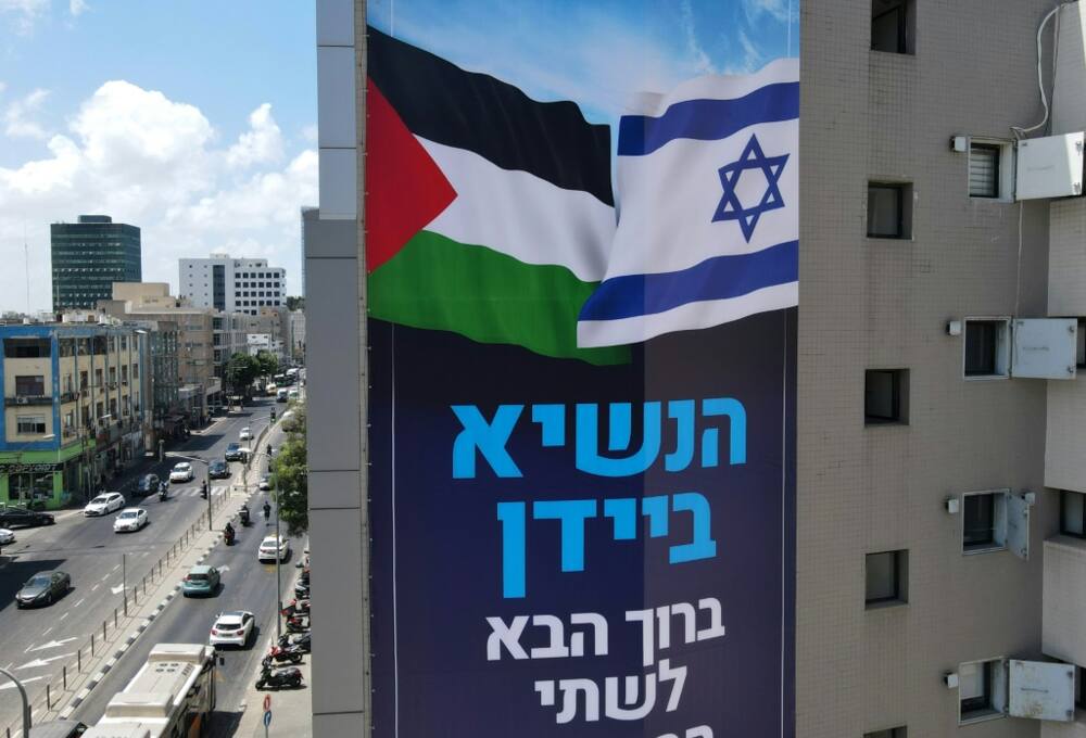 A billboard by Israeli anti-occupation group Peace Now, welcomes US President Joe Biden, in the coastal city of Tel Aviv