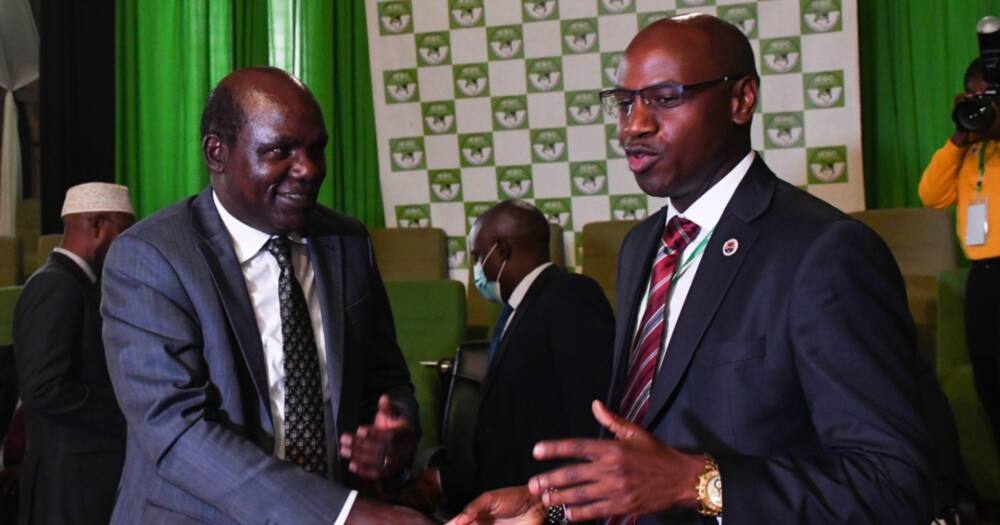 IEBC Chairman Wafula Chebukati(l) and Walter Mong'are.