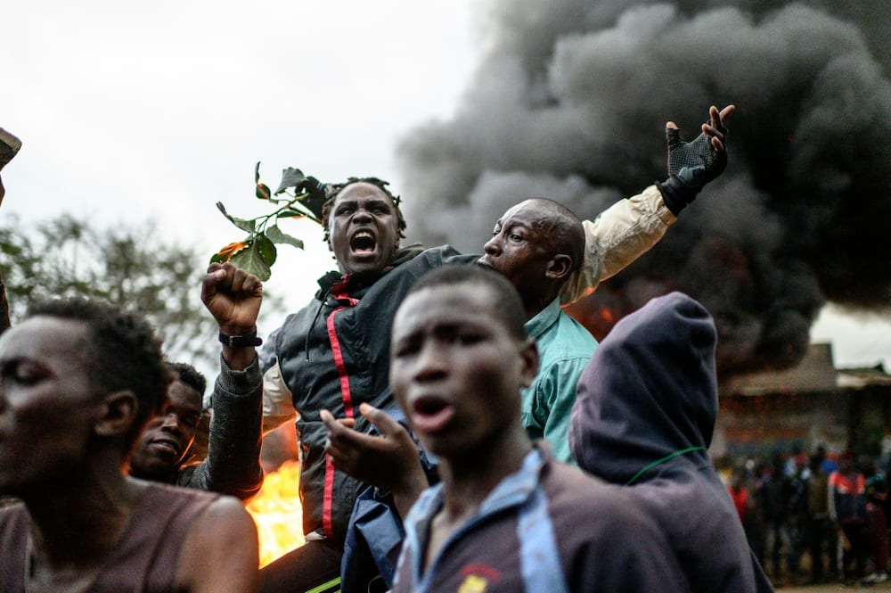 Supporters of Raila Odinga protest against the results of Kenya's general election in Kibera, Nairobi