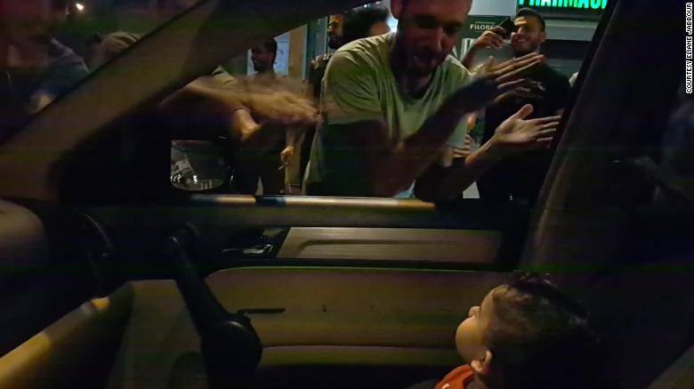 Sweet moment as protesters sing Baby Shark to scared child during demonstration