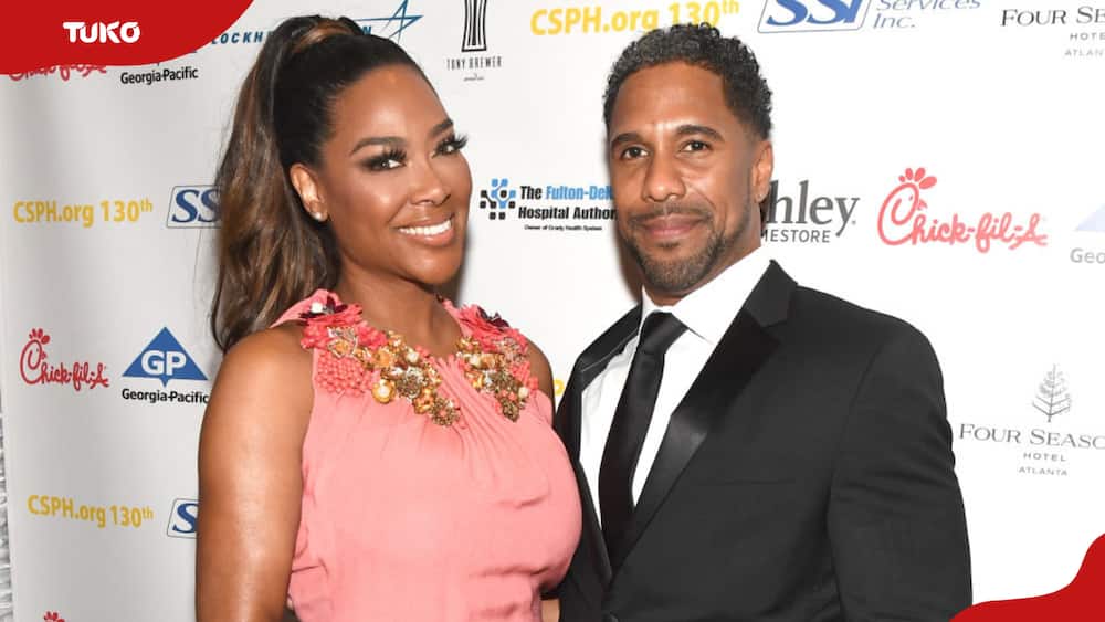 Kenya Moore (L) and Marc Daly pose for a photo at the Carrie Steele-Pitts Home 130th Anniversary Gala