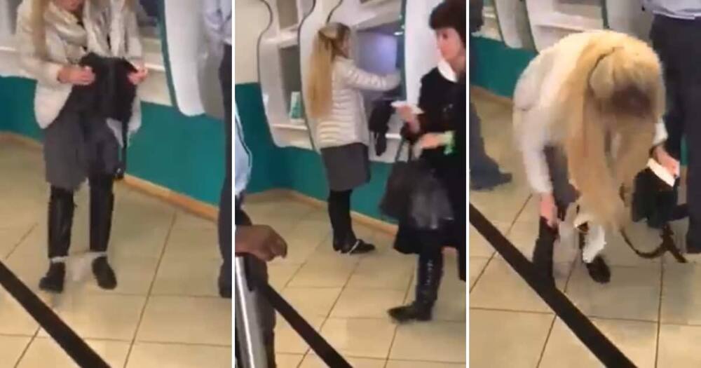 Woman at ATM with underwear around her ankles