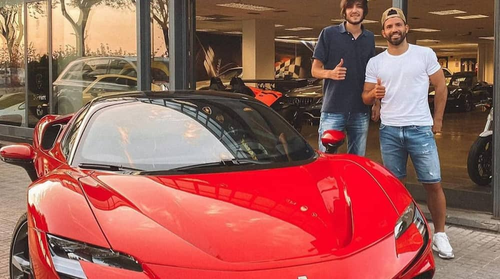 Sergio Aguero poses with his new electric Ferrari SF90 Stradale. Photo: The Sun.