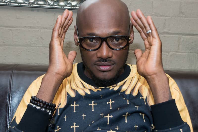 Adorable video of 2face Idibia holding wife's shoes at an award's ceremony goes viral