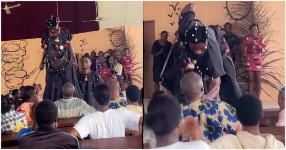 Reactions as student grabs lecturer's neck during class presentation