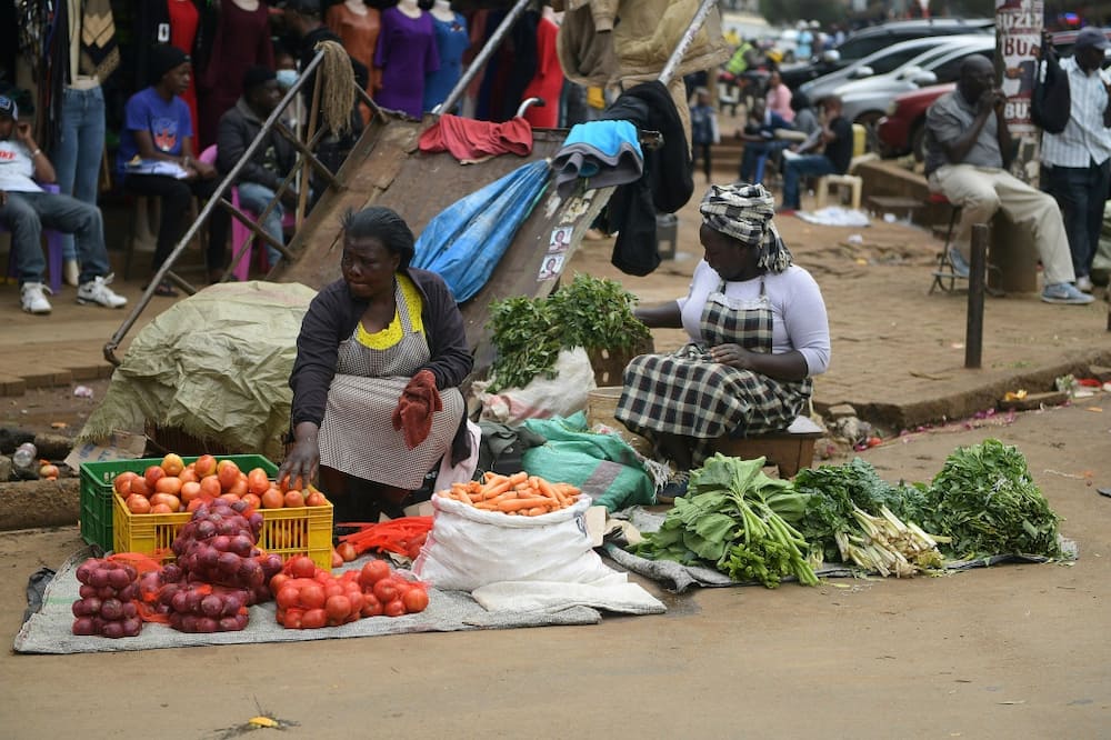 Street vendors known as 'mama mboga' are found in markets and on roadsides across Kenya