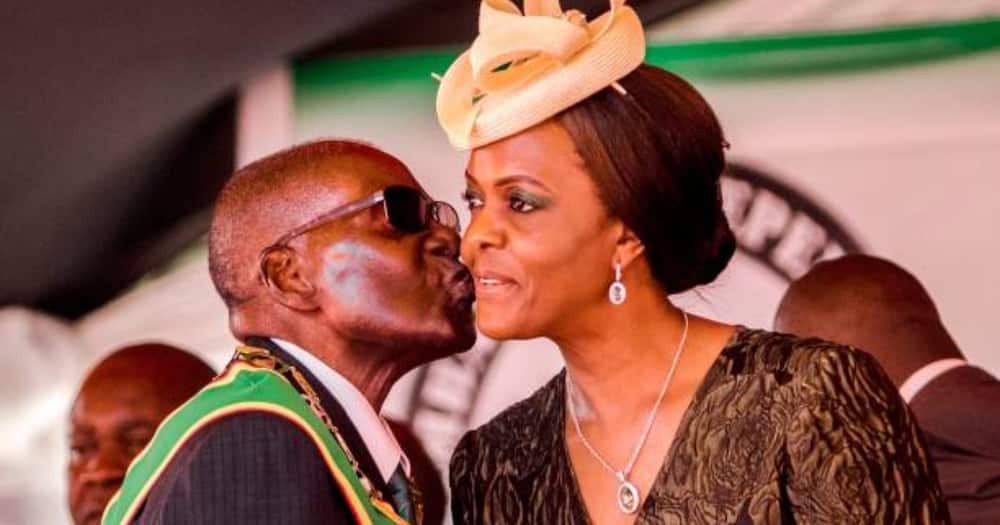 Robert Mugabe and his wife Grace share a lovely moment.