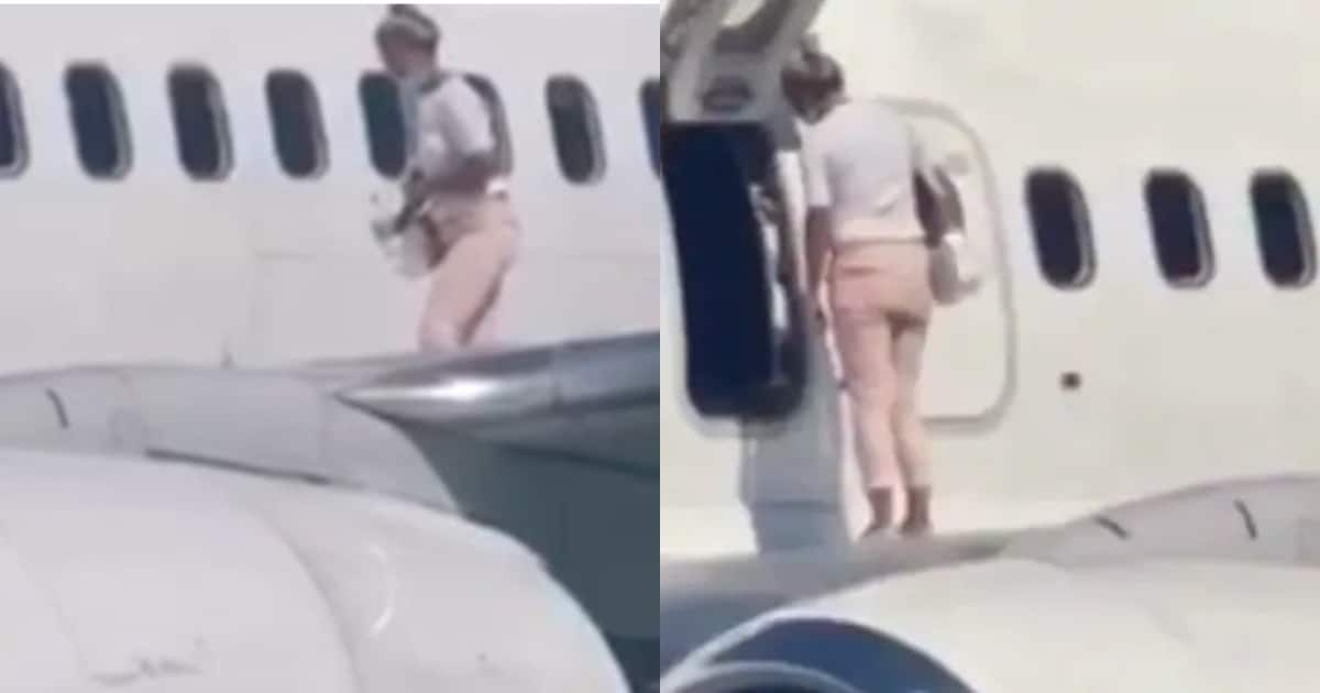 Woman climbs onto airplane wing after complaining she was feeling hot