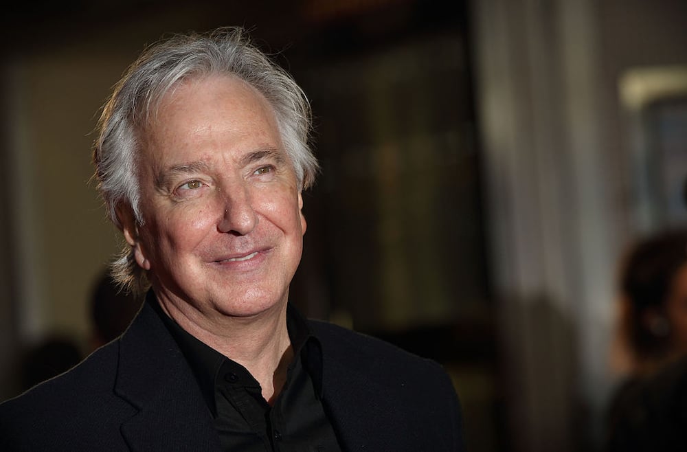 Alan Rickman posing for a photo at the London Film Festival at Odeon West End