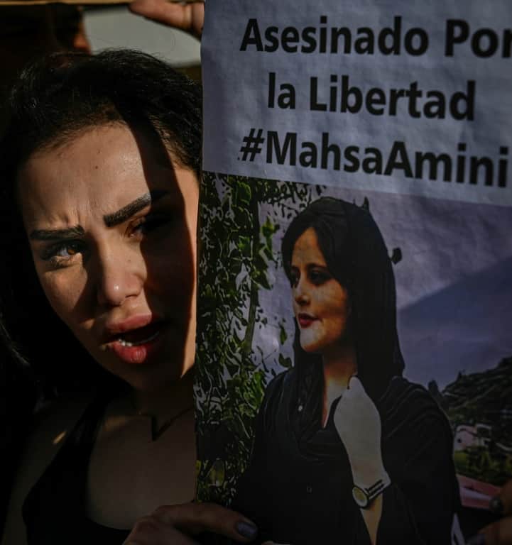 A protester shouts at a demonstration in support of Iranian women in Santiago, Chile on October 7, 2022