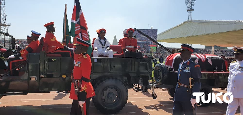 Final salute: Colourful display as military officers escort Moi's body to Nyayo Stadium