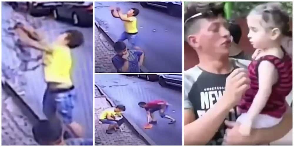 The two-year-old child (in a striped vest) had jumped from a window on the second floor of the building. Photo Credit: Screengrabs from video shared by BBC News.