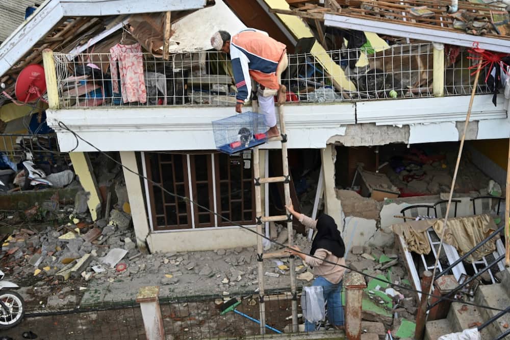 The rescue mission carried on into Tuesday to find those trapped by the disaster and residents tried to retrieve their pets and belongings