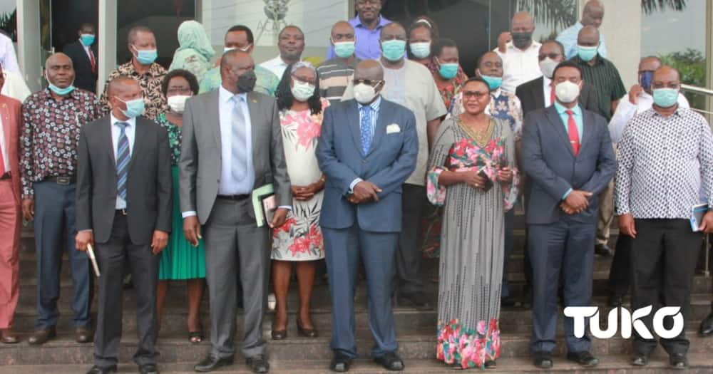 Education CS George Magoha (c), Moi Kapsowar Girls Principal, Hellen Mabese (third from right).