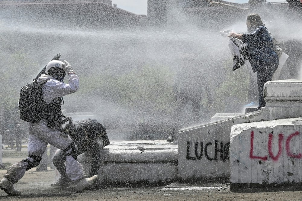 Police used water cannon on the protesters in Chile