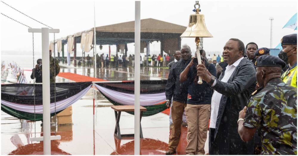 Uhuru Kenyatta rings bell attached to MV II Uhuru.