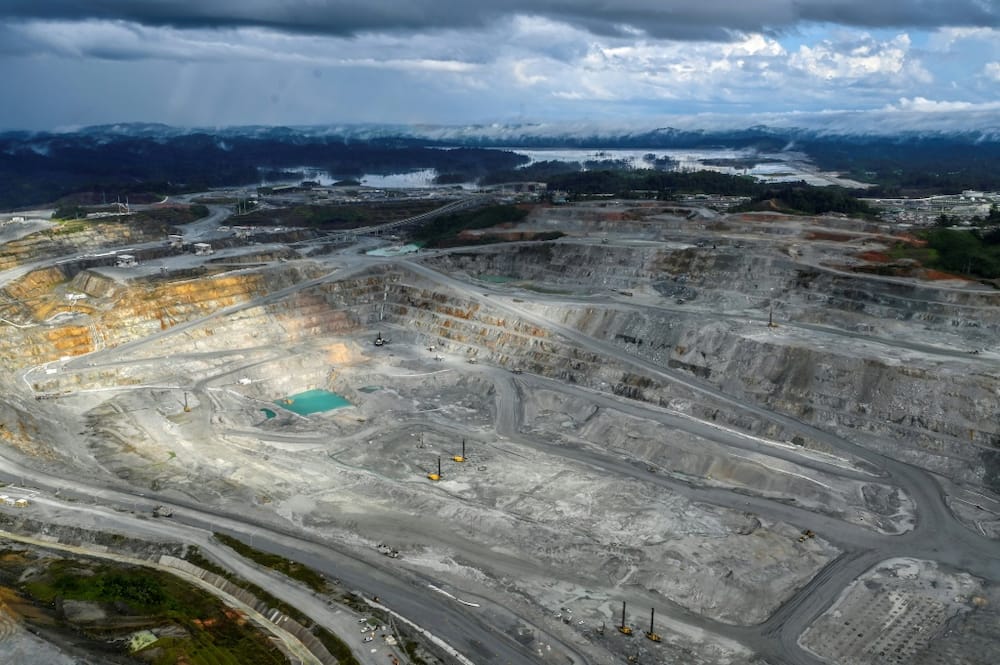 The copper mining pit, a kilometer wide, produces 300,000 tonnes of copper concentrate per year
