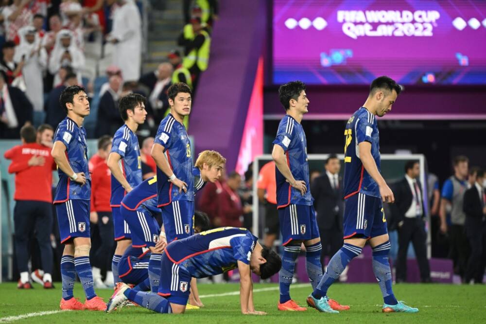 Japan's dejected players after they lost the penalty shootout to Croatia
