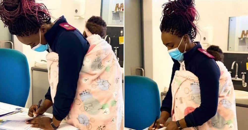 Local nurse holds baby while mom gets treated, photos go viral