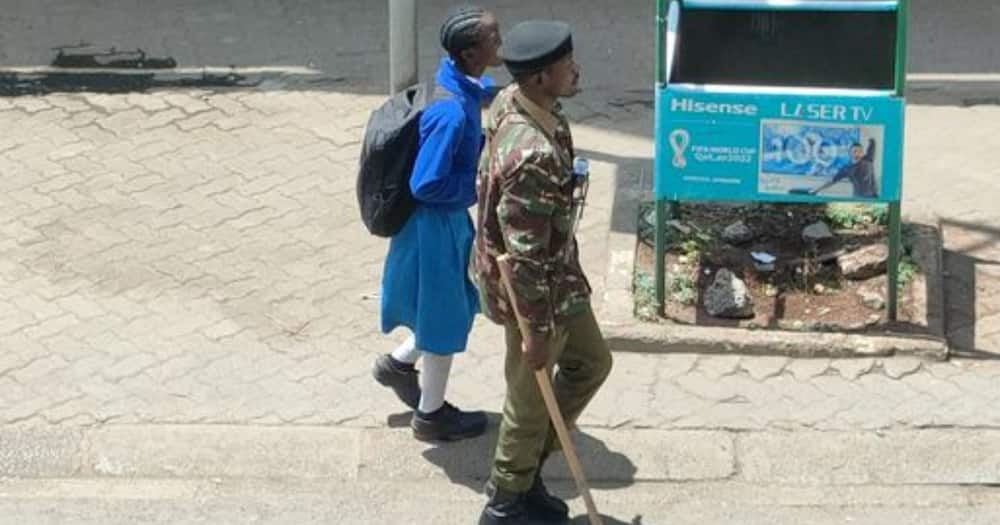 Police walking school girl at Luthuli Avenue
