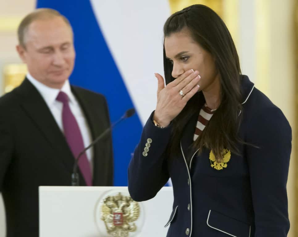 Russian pole vaulter Yelena Isinbayeva, a member of the International Olympic Committee, wipes a tear during a reception by President Vladimir Putin for Olympic athletes at the Kremlin in July 2016